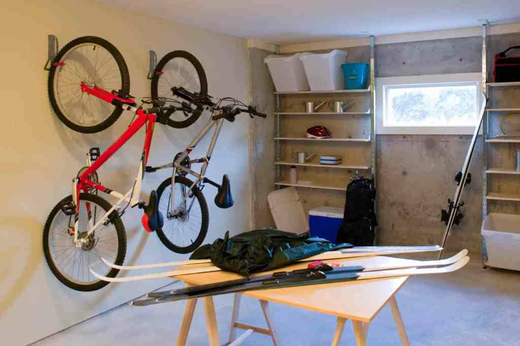 Bike mounts on the wall in a garage.