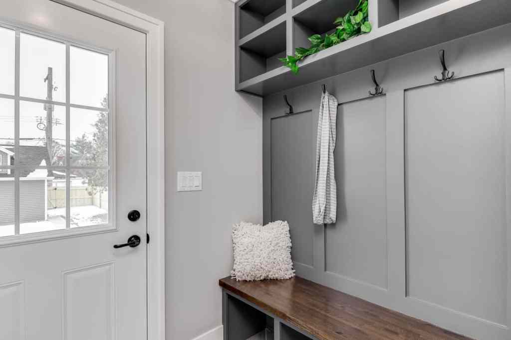 Gray mudroom with shoe storage.