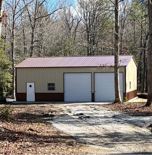 Large garage surrounded by trees