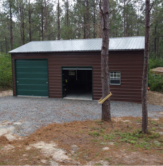 Brown garage with a green garage door