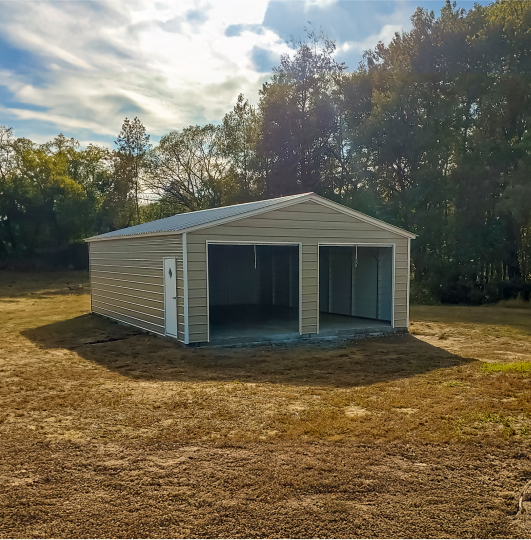 Garage on a field with two open garage doors