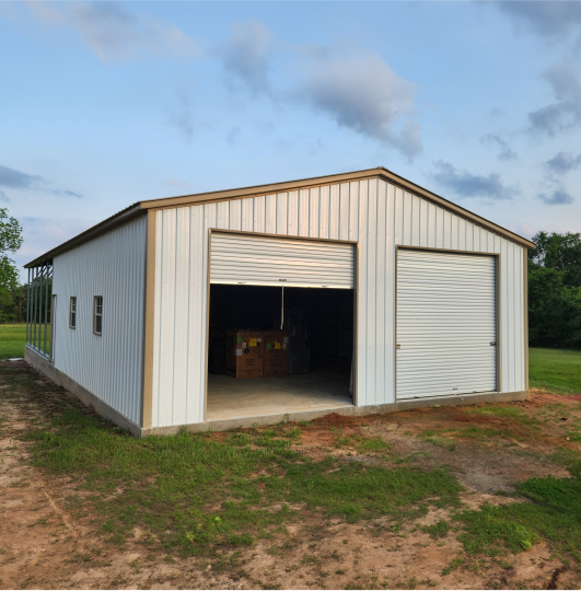 Garage with one garage door open and one door closed