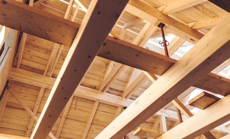 A wood building with beams.