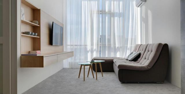 Modern living room setup inside a converted metal garage space