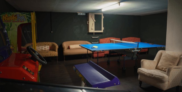 Game room with a ping-pong table and arcade machines