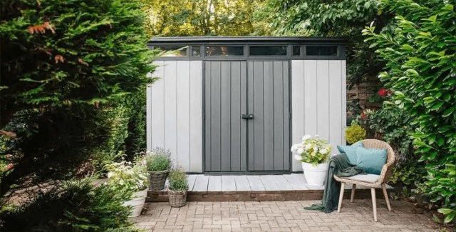 Stylish outdoor shed surrounded by greenery