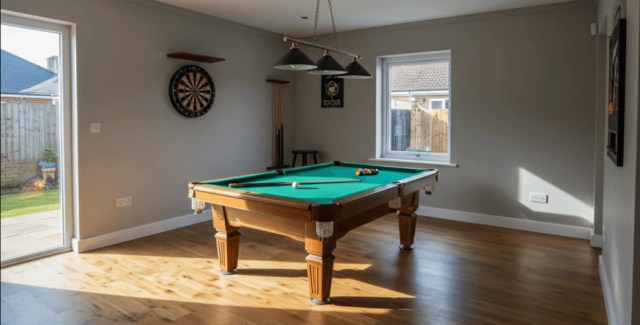 Game room with a pool table, dartboard, and natural lighting