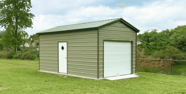 Compact tan metal garage with a roll-up door and a side door, situated in a fenced backyard