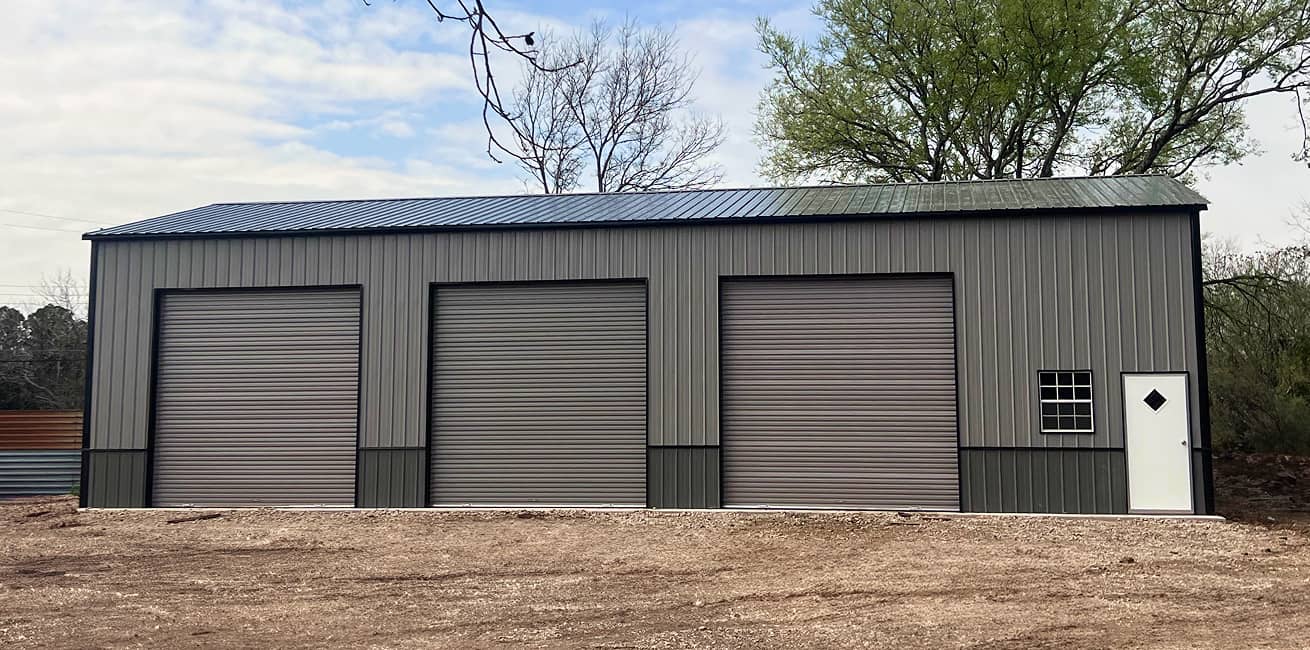 Gray Metal Building with 3 garage doors