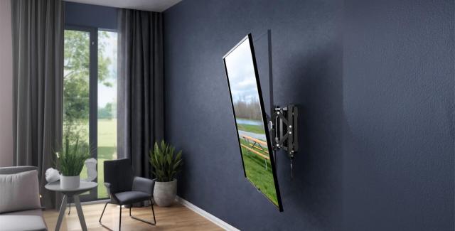 Flat-screen TV mounted on a wall using an articulating wall mount, shown from the side
