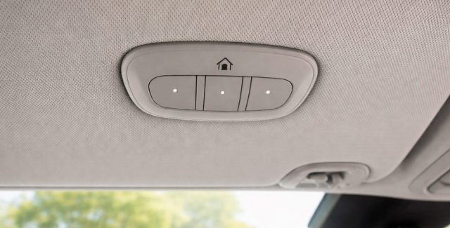 Overhead console buttons inside a vehicle used to program a garage door opener