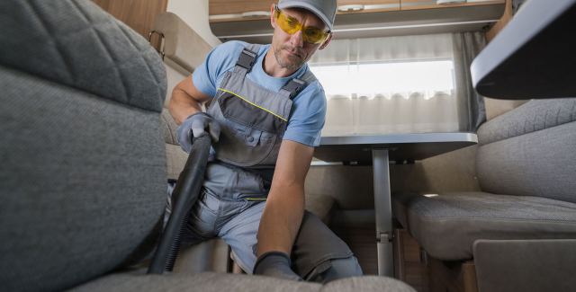 man cleaning an rv