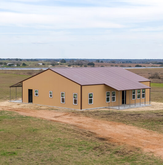 Large brown metal building with lean-tos
