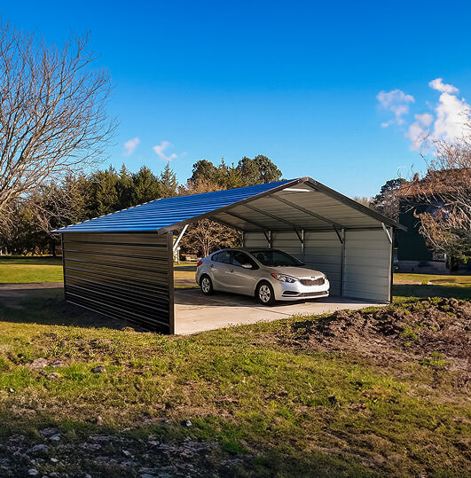 Large carport with closed sides and a car inside of it
