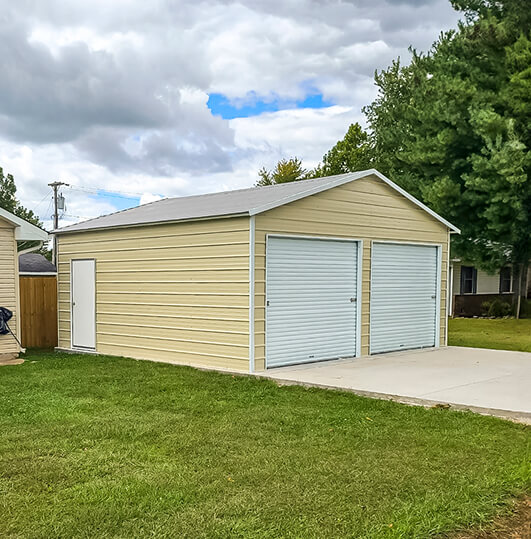 Yellow metal building with two garage doors