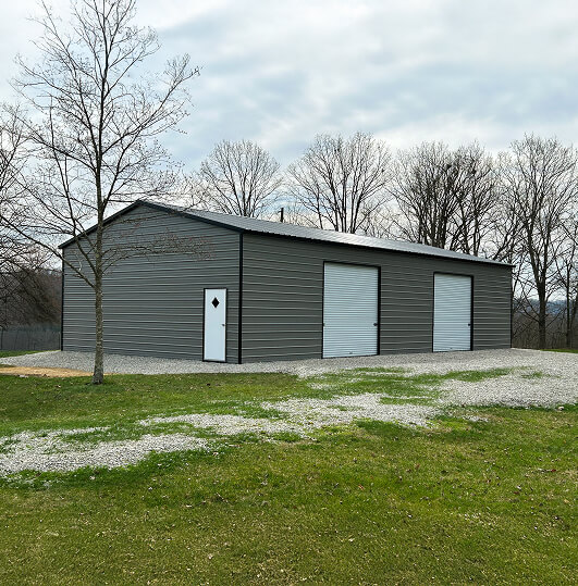 Gray metal building with white doors