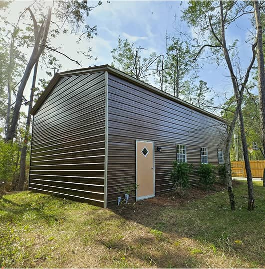 Metal building in a forest