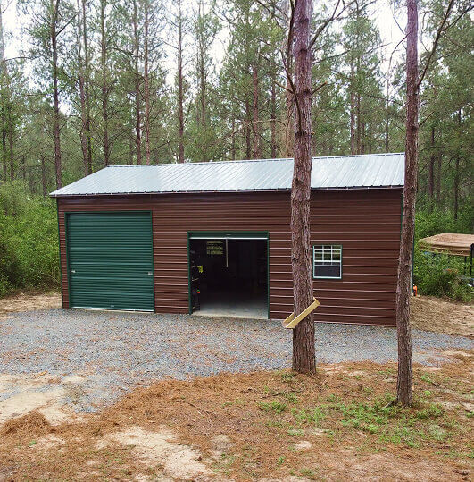 Brown garage with a green garage door