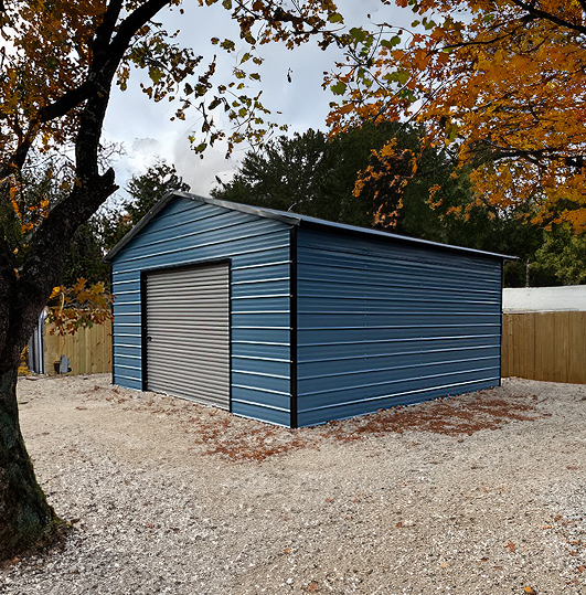 Small blue garage with gray garage door