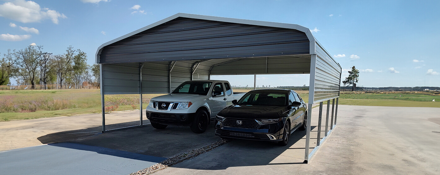 Two cars under a metal carport.