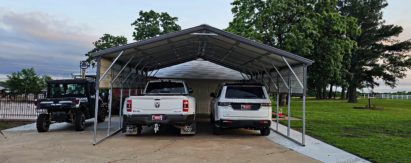 Two vehicles under a carport shelter