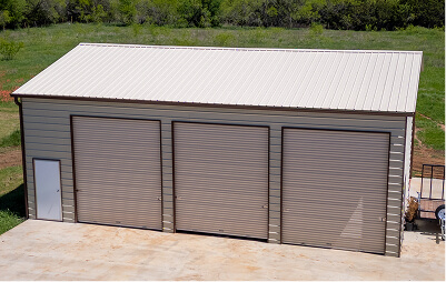 Large garage with three roll-up doors