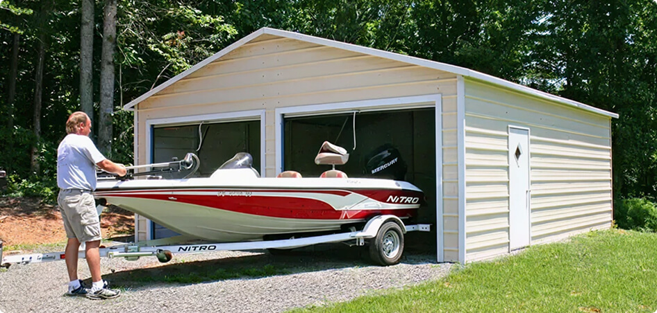Man loading boat into garage