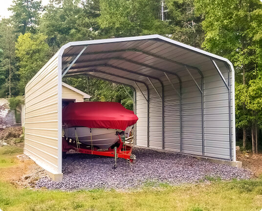 Boat stored under metal shelter