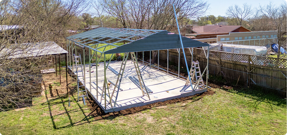 Metal building framework in backyard