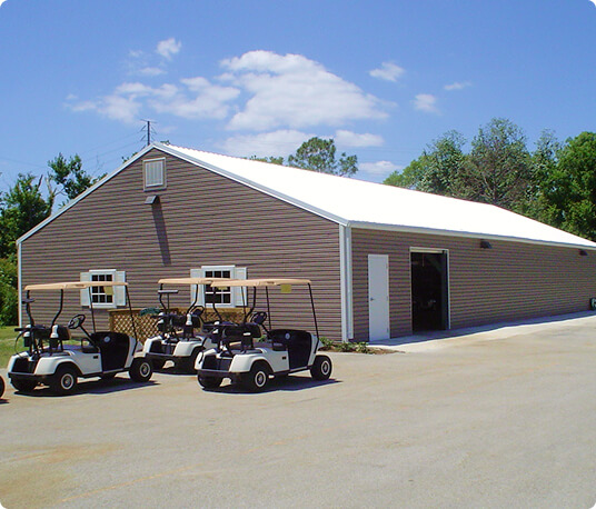 Large garage with parked golf carts.