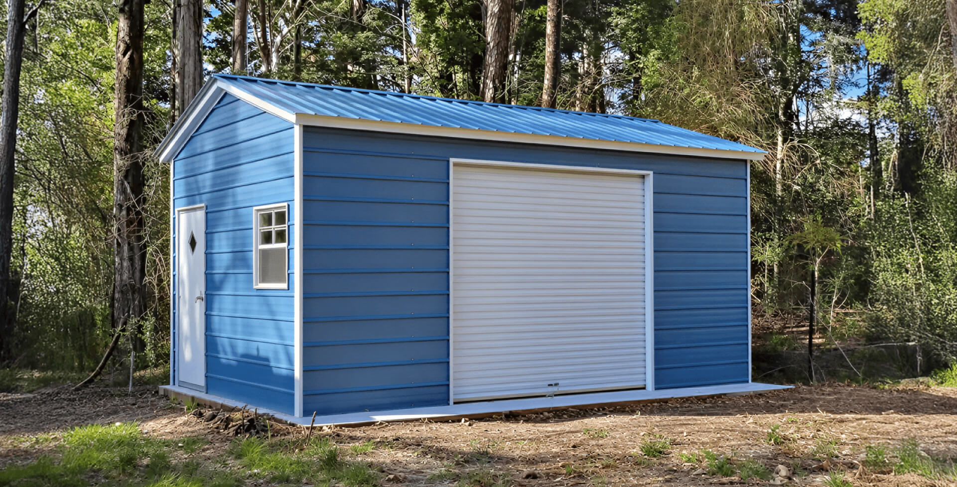 Small blue metal garage with a gabled roof and white trim. It includes a white roll-up door, a white entry door with a diamond-shaped window, and a single window on the side.