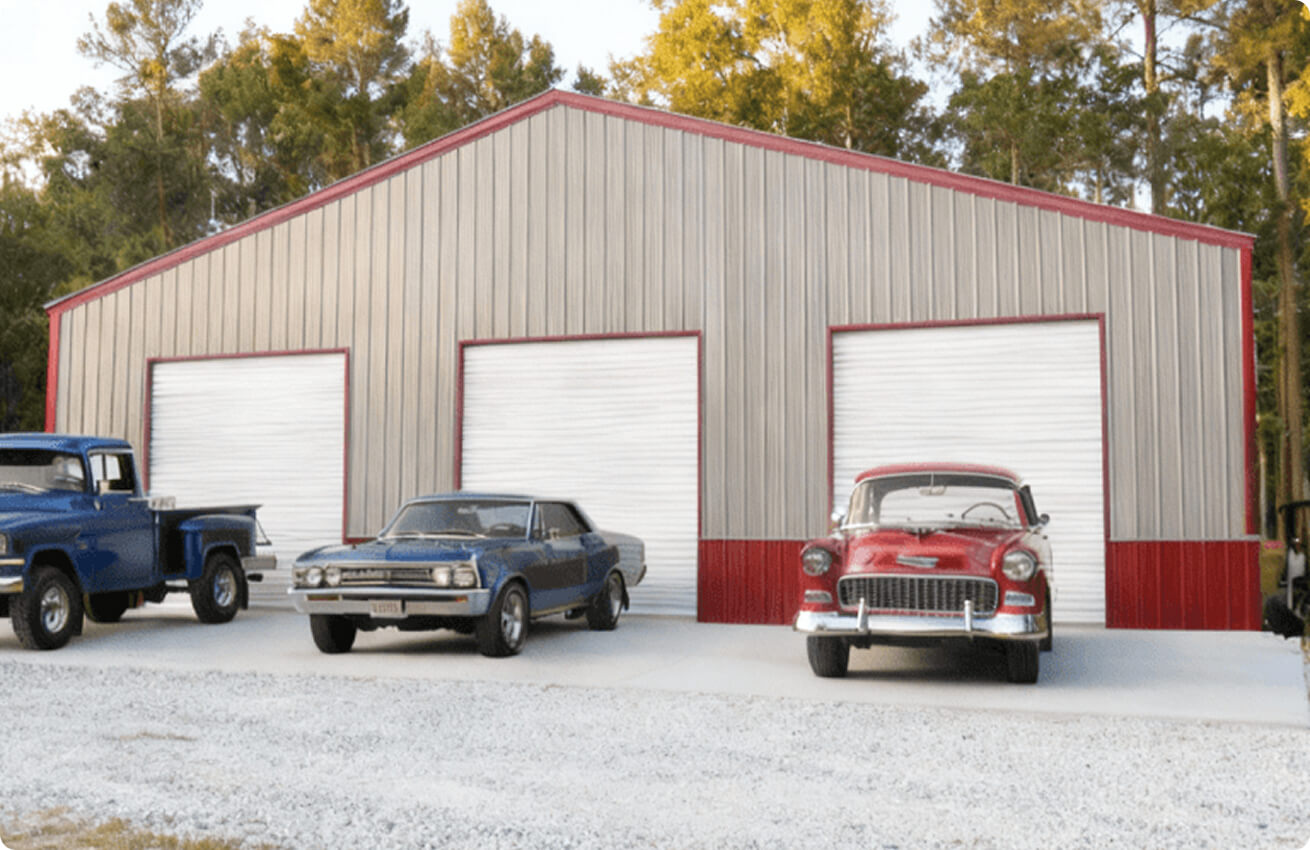 60x100 metal building with three roll-up garage doors used as a large enclosed garage and vehicle storage facility