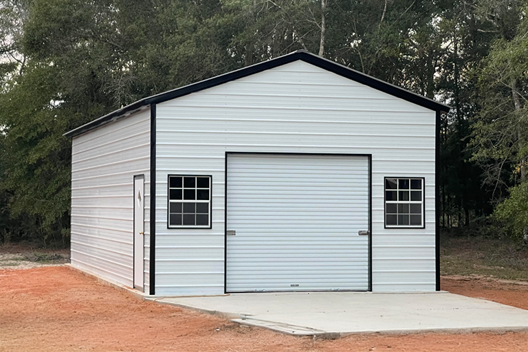 Prefabricated metal storage building with roll-up garage door and windows, representing a new factory-direct storage solution compared to repo storage buildings for sale across multiple states.