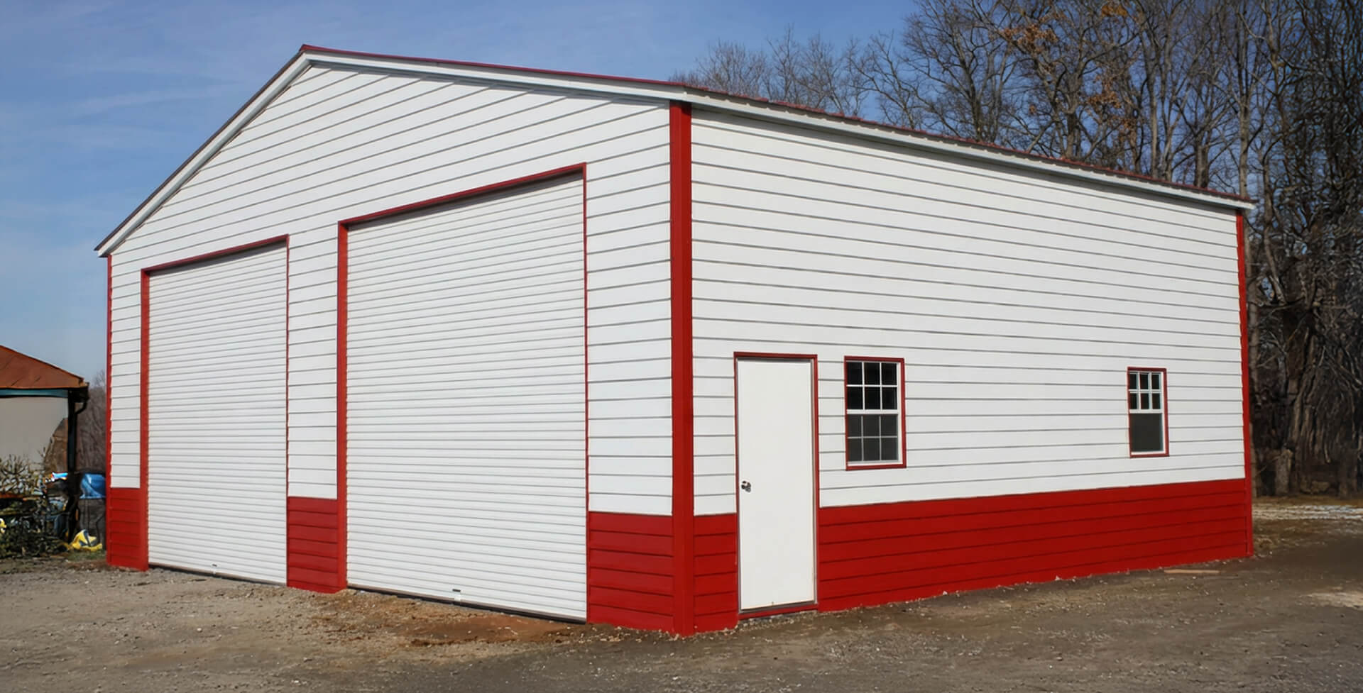 Fully enclosed 50×60 metal building with optional wainscoting and walk-in door for added durability and visual contrast.