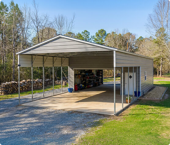 A partially enclosed Carolina metal carport demonstrates how side panels and doors can be added for increased storage and equipment protection.
