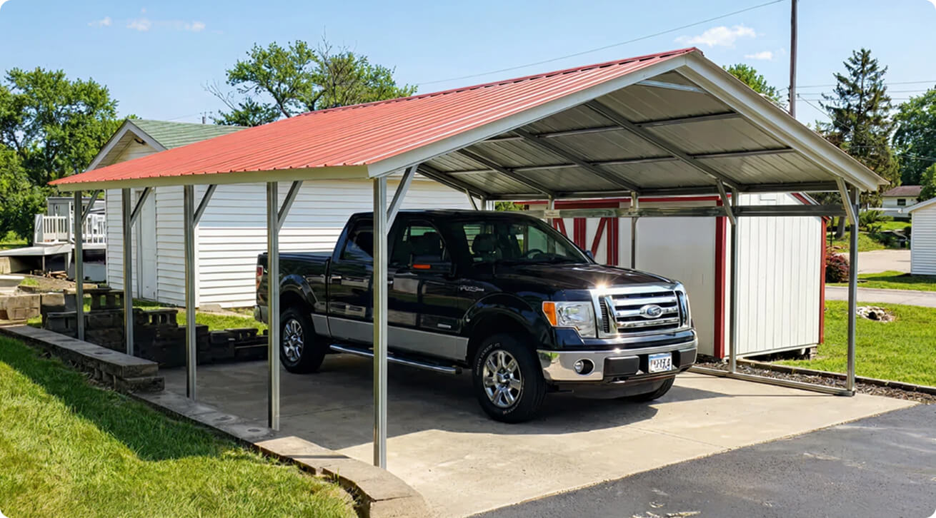 This enclosed Carolina-style metal structure shows how a carport can be upgraded into a fully enclosed garage using Alan’s customization options.