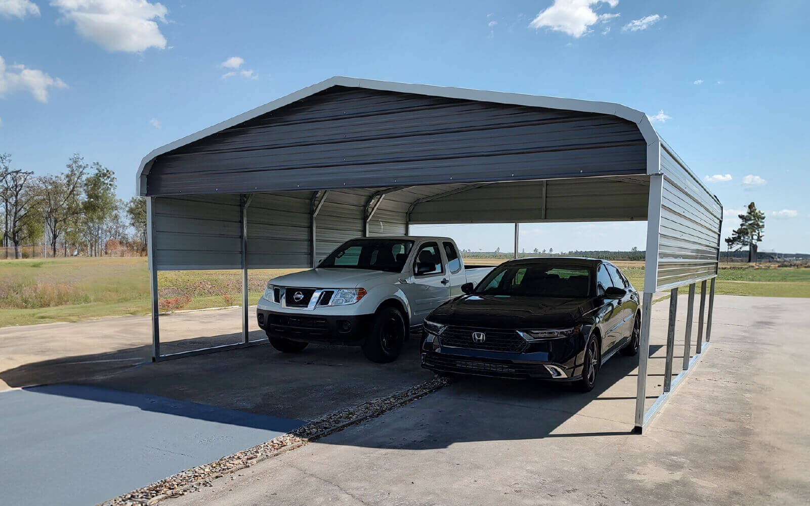 Two cars under a metal carport