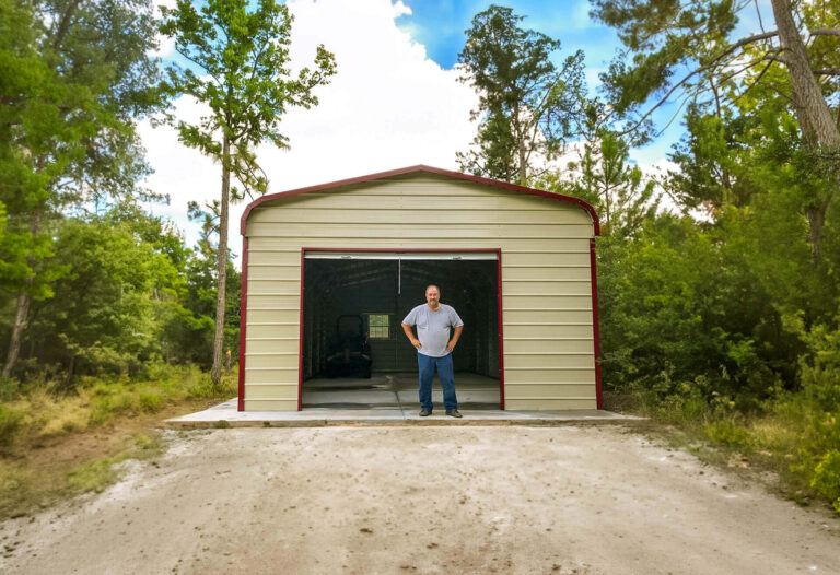 Man standing in front of garage.