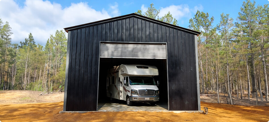 Large black garage with RV inside