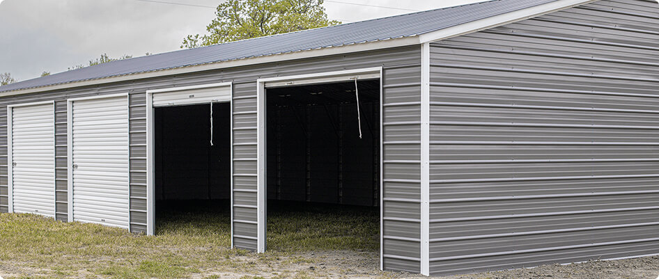 Detached 4-bay metal garage with four wide openings, ideal for parking four vehicles with side-by-side access and extra storage space.